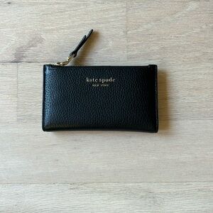 Kate spade wallet black with gold details and pale pink interior